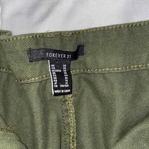 Juniper green mom jeans with pockets and tears